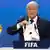 FIFA President Blatter holds up a card that read "Russia"