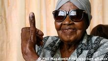 108-year-old MMaphuti Mabitsela shows her marked thumb nail after casting her special vote, at her home in Atteridgeville, near Pretoria, South Africa on Monday May 6, 2019. Mabitsela took part in South Africa's special voting for the elderly and infirm where electoral officials go to their homes or care facilities before the actual voting day of May 8. (AP Photo/Phill Magakoe)