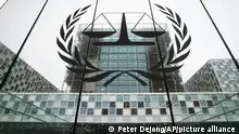 FILE- the International Criminal Court, or ICC, is seen in The Hague, Netherlands, Nov. 7, 2019. The chief prosecutor of the International Criminal Court says that an alleged leader of a Sudanese militia known as “devils on horseback” took a “strange glee” in his ruthless reputation during the Darfur conflict. Prosecutor Karim Khan made the comments Tuesday, April 5, 2022 as the man's trial opened. The 72-year-old defendant, Ali Muhammad Ali Abd–Al-Rahman, also known as Ali Kushayb, pleaded innocent to all 31 charges of war crimes and crimes against humanity. (AP Photo/Peter Dejong, File)