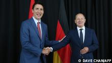 Canada's Prime Minister Justin Trudeau (L) shakes hands with German Chancellor Olaf Scholz (R) during their meeting at the Montreal Science Centre in Montreal, Quebec, Canada on August 22, 2022. - Chancellor Scholz and German Economic Minister Robert Habeck are visiting Canada to discuss energy trade. (Photo by Dave Chan / AFP)