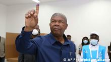 Angola President Joao Lourenco shows his marked finger during the voting process at a polling station in Luanda, Angola, Wednesday, Aug. 24, 2022. President Joao Lourenco is running for a second five-year term while his party, the Peoples' Movement for the Liberation of Angola, known by its Portuguese acronym MPLA, is campaigning to extend its 47-year run as the country's ruling party. (AP Photo)