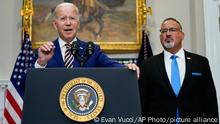 President Joe Biden speaks about student loan debt forgiveness in the Roosevelt Room of the White House, Wednesday, Aug. 24, 2022, in Washington. Education Secretary Miguel Cardona listens at right. (AP Photo/Evan Vucci)