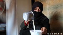 25/06/2022
9660: Titel: Moufida (38) pours milk into a bowl Beschreibung: Moufida is 38 years, a Syrian woman working inside her tent in Al-Tah camp within the milk-making project, which is within the framework of the small projects offered in the camps Schlagworte: Syria, women, empowerment, Spark of Hope initiative, small projects, milk making
Coyyright: Omar Albam
Nutzungserlaubnis: für alles
