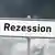 A sign post reading "Rezession"