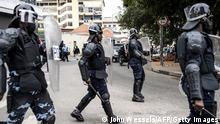 Angolan riot police take position after around a hundred people protest over wages in Luanda on August 25, 2022. (Photo by JOHN WESSELS / AFP) (Photo by JOHN WESSELS/AFP via Getty Images)