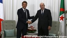 French President Emmanuel Macron, left, shakes hands with Algerian President Abdelmajid Tebboune before their talks, Thursday, Aug. 25, 2022 in Algiers. French President Emmanuel Macron is in Algeria for a three-day official visit aimed at addressing two major challenges: boosting future economic relations while seeking to heal wounds inherited from the colonial era, 60 years after the North African country won its independence from France. (AP Photo/Anis Belghoul)