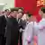 North Korean leader Kim Jong Un shakes hands with a health official in Pyongyang, North Korea, Wednesday, Aug. 10, 2022