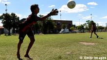 PROGRESO, ARGENTINA - FEBRUARY 15: Young boys play soccer near the gymnasium of Sala's boyhood club San Martin de Progreso on February 15, 2019 in Progreso, Argentina. 28-year-old striker was killed when the private plane carrying him from Nantes to Cardiff crashed in the English Channel near Alderney on January 21. Sala's body was recovered from the wreckage on February 6 and pilot David Ibbotson remains missing. (Photo by Gustavo Garello/Getty Images)