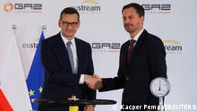 Slovak Prime Minister Eduard Heger and Polish Prime Minister Mateusz Morawiecki take part in the opening of a gas interconnector link between the central European neighbours in Strachocina, Poland August 26, 2022. REUTERS/Kacper Pempel