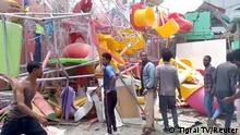 People inspect a damaged playground following an air strike in Mekelle, the capital of Ethiopia's northern Tigray region, August 26, 2022 in this still image taken from video. Tigrai TV/Reuters TV via REUTERS
THIS IMAGE HAS BEEN SUPPLIED BY A THIRD PARTY. MANDATORY CREDIT. NO RESALES. NO ARCHIVES