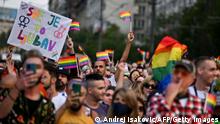 People wave rainbow flags and chant slogans during the Belgrade Pride march, on September 18, 2021. (Photo by Andrej ISAKOVIC / AFP) (Photo by ANDREJ ISAKOVIC/AFP via Getty Images)