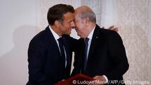 French President Emmanuel Macron (L) and Algeria's President Abdelmadjid Tebboune (R) attend a signing ceremony in the pavilion of honour at Algiers airport, in Algiers, on August 27, 2022. - Emmanuel Macron is on a three-day visit to Algeria aimed at mending ties with the former French colony, which this year marks its 60th anniversary of independence. (Photo by Ludovic MARIN / AFP) (Photo by LUDOVIC MARIN/AFP via Getty Images)
