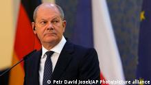 German Chancellor Olaf Scholz looks up at during a press conference at the government's headquarters in Prague, Czech Republic, Monday, Aug. 29, 2022. (AP Photo/Petr David Josek)