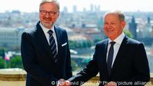 Czech Republic's Prime Minister Petr Fiala, left, welcomes German Chancellor Olaf Scholz on his visit to Prague, Czech Republic, Monday, Aug. 29, 2022. (AP Photo/Petr David Josek)