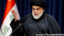 FILE PHOTO: Iraqi populist leader Muqtada al-Sadr delivers a televised speech in Najaf, Iraq August 3, 2022. REUTERS/Alaa Al-Marjani/File Photo