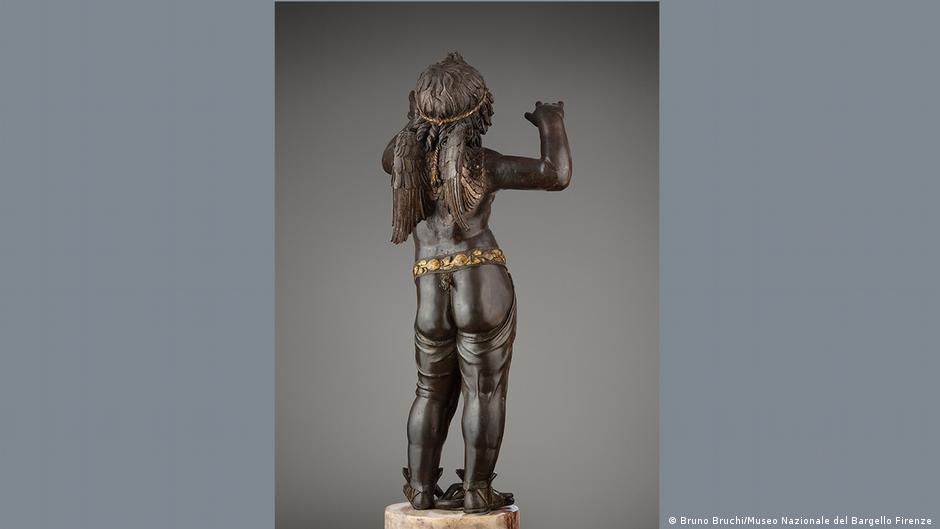 'Amor Atis' by Donatello: black sculpture of an angel from behind.