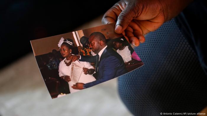 Charity Oriakhi, widow of a street vendor Alika Ogochukwu, shows a picture of her wedding with Alika Charity Oriakhi, widow of a street vendor Alika Ogochukwu, shows a picture of her wedding with Alika