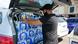 A Jackson, Mississippi resident fills his car with bottled water A Jackson, Mississippi resident fills his car with bottled water