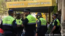 This picture released by Telam shows police officers standing at the entrance of the Luz Medica hospital, where nine people infected with bilateral pneumonia of unknown origin have been treated, in Tucuman, Argentina, on September 1, 2022. - A third person died this week in Argentina from pneumonia of unknown origin, local health authorities said on Thursday. Nine people in northwestern Tucuman province have been infected by the mysterious respiratory illness, including eight medical staff at the same private clinic, and three have died since August 29, Tucuman health minister Luis Medina Ruiz told reporters. Authorities are conducting tests on the illness but Medina said they have ruled out COVID-19, flu and influenza types A and B. (Photo by Diego ARAOZ / TELAM / AFP) / Argentina OUT / RESTRICTED TO EDITORIAL USE - MANDATORY CREDIT AFP PHOTO / TELAM / DIEGO ARAOZ - NO MARKETING - NO ADVERTISING CAMPAIGNS