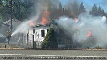 September 2, 2022: Firefighters battle flames at a home burned by the Mill fire near Weed, California, on Friday, Sept. 2, 2022. The wildfire erupted at a timber mill near the town of Weed in Siskiyou County on Friday, prompting evacuations across a wide area and closing Highway 97. (Credit Image: © Ryan Sabalow/The Sacramento Bee via ZUMA Press Wire