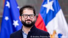 Chile's President Gabriel Boric stands outside a polling station during a press conference after casting his vote in a plebiscite on a new draft of the Constitution in Punta Arenas, Chile, Sunday, Sept. 4, 2022. Chileans are deciding if they will replace the current Magna Carta imposed by a military dictatorship 41 years ago. (AP Photo/Andres Poblete)