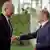 Ukrainian Prime Minister Denys Shmyhal and German Chancellor Olaf Scholz shake hands