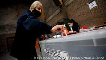 A woman casts her vote in a plebiscite on a new draft of the Constitution in Santiago, Chile, Sunday, Sept. 4, 2022. Chileans are deciding if they will replace the current Magna Carta imposed by a military dictatorship 41 years ago. (AP Photo/Cristobal Escobar)