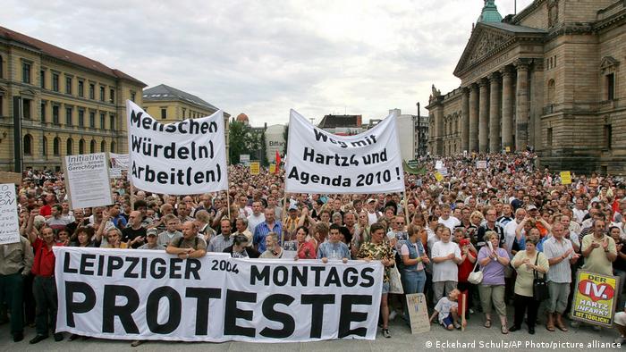 More than 20,000 people protest against social welfare cuts during a demonstration in the city of Leipzig, eastern Germany, Monday, Aug. 16, 2004.
