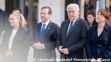 Israeli President Isaac Herzog, second from left, and his wife Michal Herzog, left, attend a wreath laying ceremony at the Holocaust memorial together with German President Frank-Walter Steinmeier, second from right, and his wife Elke Buedenbender, right, in Berlin, Germany, Tuesday, Sept. 6, 2022. (AP Photo/Christoph Soeder)