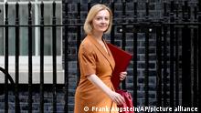 FILE - Britain's Secretary of State for Foreign, Commonwealth and Development Affairs, Liz Truss, arrives for a cabinet meeting at 10 Downing Street in London, Tuesday, July 19, 2022. Britain’s next prime minister will take office amid turmoil: galloping inflation, a war in Ukraine, souring relations with China, a changing climate. But not all those issues are getting equal attention as Foreign Secretary Truss and former Treasury chief Rishi Sunak vie for the votes of about 180,000 Conservative Party members. One of them will be elected Sept. 5 to replace the scandal-tarnished Boris Johnson, as Britain's next prime minister. (AP Photo/Frank Augstein, File)