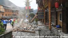 Workers clear the debris of damaged buildings in Moxi township after a 6.8-magnitude earthquake hit Luding county in Ganzi Prefecture in southwest China's Sichuan province on Tuesday, Sept. 6, 2022. At least 65 people have been killed in a 6.8-magnitude earthquake that jolted Luding county in Sichuan province on Monday.(Photo By Feng Zi/ColorChinaPhoto) Color China Photo/AP Images
