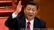 FILE - Chinese President Xi Jinping raises his hand to show approval of a work report during the closing ceremony for the 19th Party Congress at the Great Hall of the People in Beijing on Oct. 24, 2017. Russian President Vladimir Putin and Xi Jinping will meet next week at a summit in Uzbekistan, a Russian official said Wednesday, Sept. 7, 2022. (AP Photo/Ng Han Guan, File)