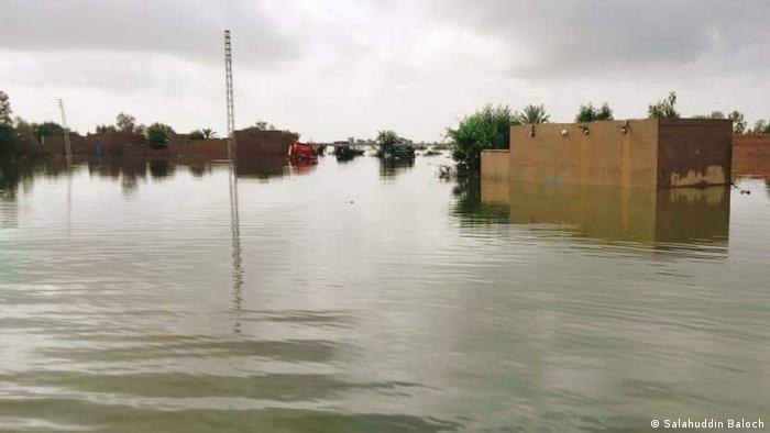 a flooded area with small houses under water