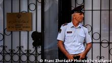 A policeman stands guard outside the Iranian Embassy in Tirana, Albania, Wednesday, Sept. 7, 2022. Albania cut diplomatic ties with Iran and expelled the country's embassy staff over a major cyberattack nearly two months ago that was allegedly carried out by Tehran on Albanian government websites, the prime minister said Wednesday. (AP Photo/Franc Zhurda)