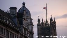 LONDON, ENGLAND - SEPTEMBER 08: The Union flag is lowered at the Houses of Parliament following the death of Queen Elizabeth II on September 08, 2022 in London, England. Elizabeth Alexandra Mary Windsor was born in Bruton Street, Mayfair, London on 21 April 1926. She married Prince Philip in 1947 and acceded the throne of the United Kingdom and Commonwealth on 6 February 1952 after the death of her Father, King George VI. Queen Elizabeth II died at Balmoral Castle in Scotland on September 8, 2022, and is survived by her four children, Charles, Prince of Wales, Anne, Princess Royal, Andrew, Duke Of York and Edward, Duke of Wessex. (Photo by Dan Kitwood/Getty Images)