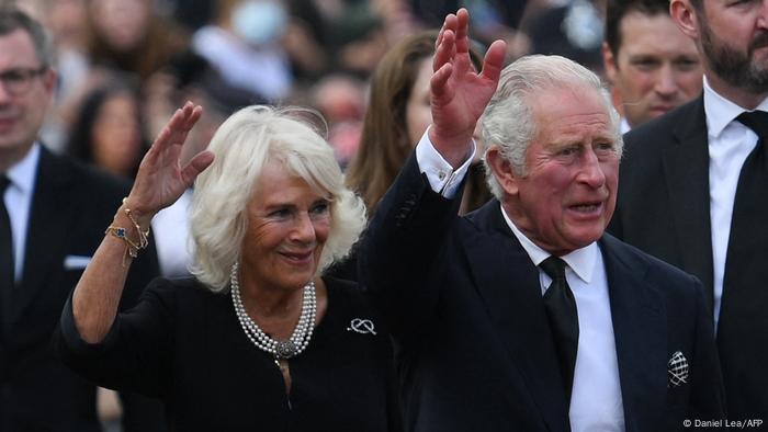UK Queen Consort, Camilla, left, and King Charles III, right, wave to crowds