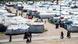 Figures of women and children visible as they walk among the tents in Camp Roj in Syria Figures of women and children visible as they walk among the tents in Camp Roj in Syria