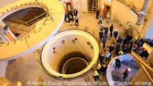 In this photo released by the Atomic Energy Organization of Iran, technicians work at the Arak heavy water reactor's secondary circuit, as officials and media visit the site, near Arak, 150 miles (250 kilometers) southwest of the capital Tehran, Iran, Monday, Dec. 23, 2019. The head of Iran's nuclear agency says his country has begun new operations at the heavy water nuclear reactor. The move intensifies pressure on Europe to find an effective way around U.S. sanctions, which block Tehran's oil sales abroad. (Atomic Energy Organization of Iran via AP)