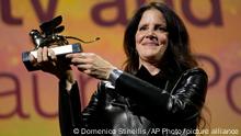 Director Laura Poitras holds the Golden Lion award for best film for 'All the Beauty and the Bloodshed' at the closing ceremony of the 79th edition of the Venice Film Festival in Venice, Italy, Saturday, Sept. 10, 2022. (AP Photo/Domenico Stinellis)