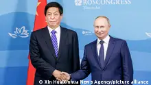 (220910) -- MOSCOW, Sept. 10, 2022 (Xinhua) -- Li Zhanshu, chairman of China's National People's Congress (NPC) Standing Committee, meets with Russian President Vladimir Putin in Russia's far eastern city of Vladivostok, Sept. 7, 2022. Li paid an official goodwill visit to Russia from Wednesday to Saturday at the invitation of Chairman of the Russian State Duma Vyacheslav Volodin. (Xinhua)