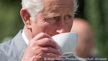 MENAI BRIDGE, WALES - JULY 14: Prince Charles, Prince of Wales has a cup of tea as he takes a tour of the gardens at Plas Cadnant Hidden Gardens during The Prince of Wales' annual summer visit to Wales on July 14, 2017 in Menai Bridge, Wales.