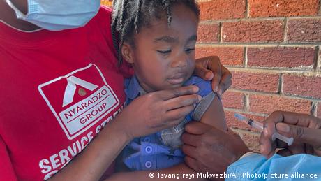 A child receives a measles vaccination jab at a local clinic in Harare