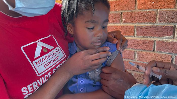 A child receives a measles vaccination jab at a local clinic in Harare