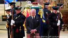 Britain's King Charles III, center, and other members of the royal family hold a vigil at the coffin of Queen Elizabeth II at St Giles' Cathedral, Edinburgh, Scotland, Monday Sept. 12, 2022. (Jane Barlow/Pool via AP)