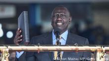 Incoming Kenyan President William Ruto takes the oath of office at the Moi International Sports Center Kasarani in Nairobi, Kenya, on September 13, 2022 during the inauguration ceremony. - William Ruto was sworn in as Kenya's fifth post-independence president at a pomp-filled ceremony on Tuesday, after his narrow victory in a bitterly fought but largely peaceful election.
Tens of thousands of people joined regional heads of state at a packed stadium in Nairobi to watch him take the oath of office, with many spectators clad in the bright yellow of Ruto's party and waving Kenyan flags. (Photo by SIMON MAINA / AFP) (Photo by SIMON MAINA/AFP via Getty Images)