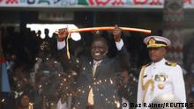 Kenya's President William Ruto displays the special sword that he received to represent his instruments of power and authority from his predecessor Uhuru Kenyatta after his official swearing-in ceremony at Moi International Stadium Kasarani in Nairobi, Kenya September 13, 2022. REUTERS/Baz Ratner