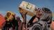 A women drinks water at a water distribution point at Muuri camp in Baidoa, Somalia A women drinks water at a water distribution point at Muuri camp in Baidoa, Somalia