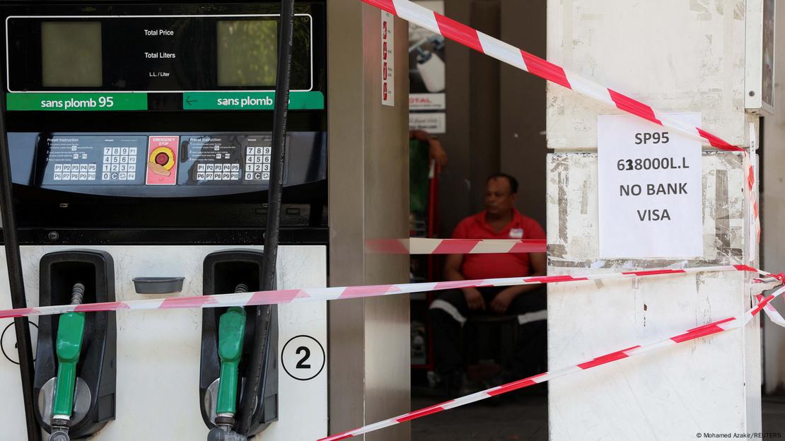 A worker sits at a closed gas station in Beirut, Lebanon September 12, 2022