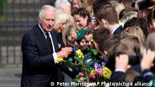 Britain's King Charles III and Queen Consort meet with members of the public during a visit to Hillsborough Castle, Northern Ireland, Tuesday, Sept. 13, 2022. (AP Photo/Peter Morrison)