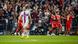 Robert Lewandowski looks on as Bayern Munich celebrate Robert Lewandowski looks on as Bayern Munich celebrate